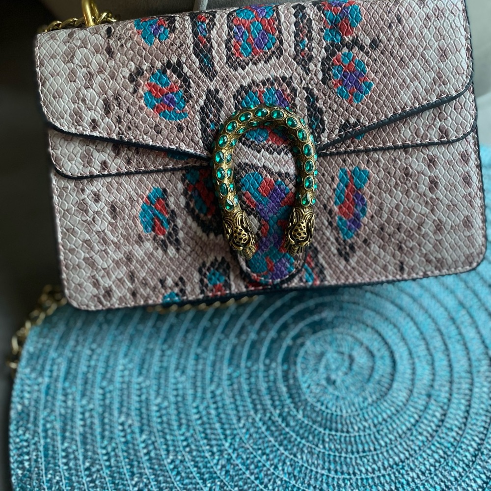 Elegant Snakeskin Crossbody Bag with Gold and Teal Accents
